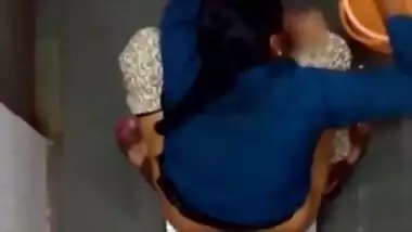 Indian girl changing pad in toilet