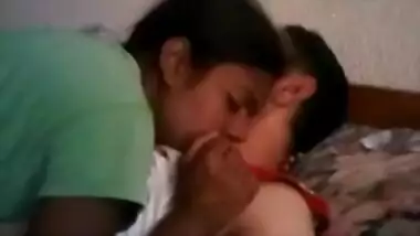 Young couple kissing in bedroom